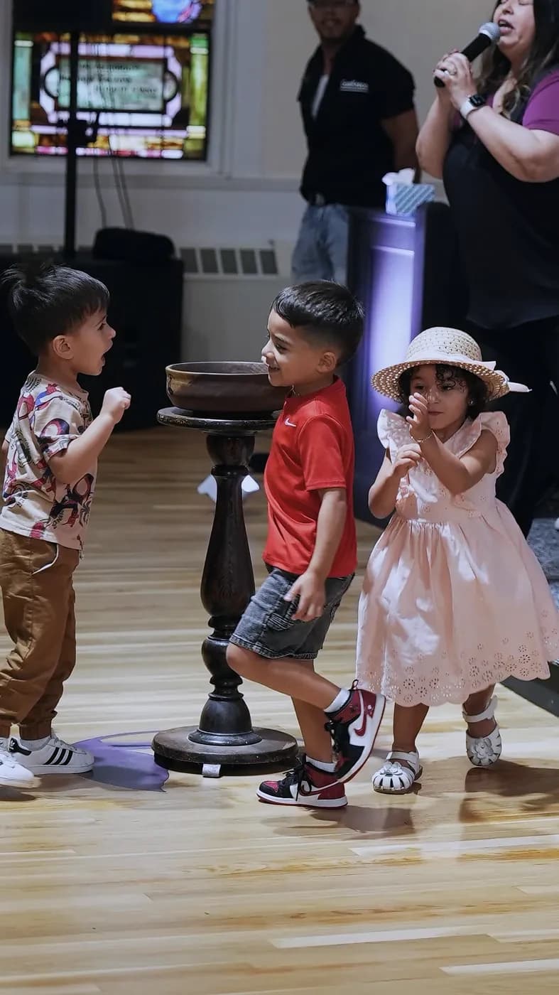 Little kids dancing at the front during Sunday worship at The Way Church