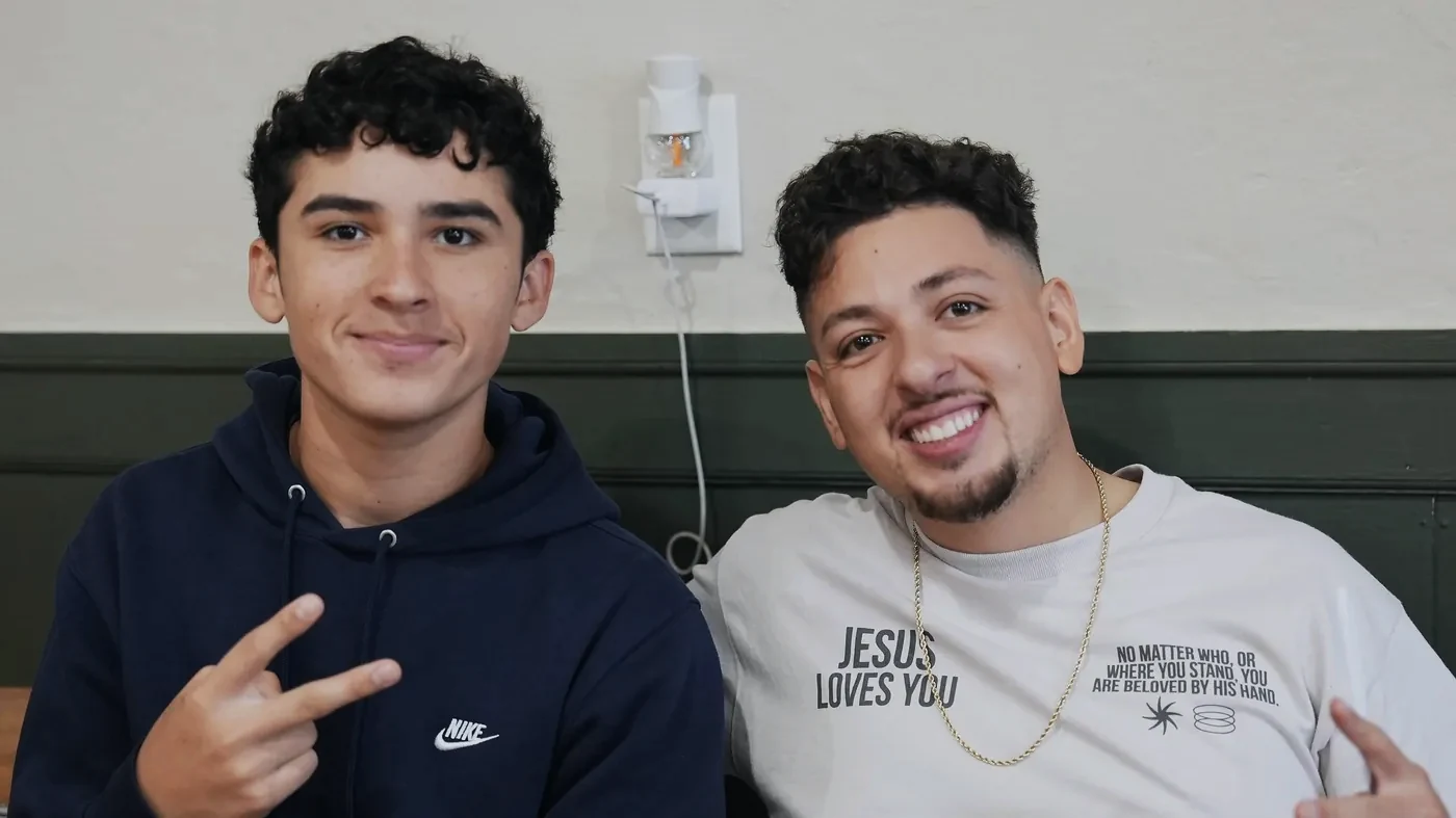 Two young men smiling together at The Way Church